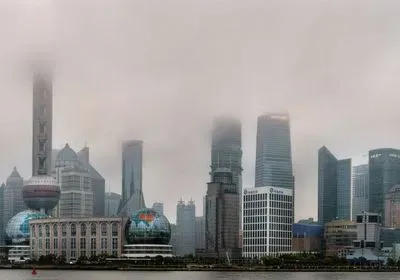 the Shanghai skyline shrouded in smog